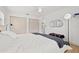 Spacious bedroom with a ceiling fan, large closet, and hardwood floors, offering ample storage and comfort at 1529 79Th N Ave, St Petersburg, FL 33702