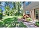 Expansive backyard features lush green grass, mature trees, and privacy landscaping at 15724 Ibisridge Dr, Lithia, FL 33547