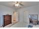 Bright bedroom with a ceiling fan, closet and natural light at 15724 Ibisridge Dr, Lithia, FL 33547