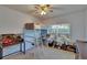 Bright bedroom features a built-in loft bed, desk, and a window that lets in natural light at 15724 Ibisridge Dr, Lithia, FL 33547