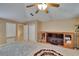 Expansive bonus room with a TV, closet and neutral carpeting, ideal for media or play at 15724 Ibisridge Dr, Lithia, FL 33547