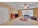 Versatile bonus room featuring neutral carpeting, entertainment center, and plenty of space at 15724 Ibisridge Dr, Lithia, FL 33547