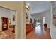 Inviting foyer with hardwood floors, decorative furnishings, and view to a screened-in pool at 15724 Ibisridge Dr, Lithia, FL 33547