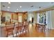 Open kitchen with breakfast bar seating and views of the adjacent living areas at 15724 Ibisridge Dr, Lithia, FL 33547