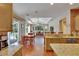 Kitchen with views of the dining area, living room, and lanai with pool at 15724 Ibisridge Dr, Lithia, FL 33547