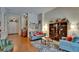 Spacious living room with hardwood floors, natural light, and stylish furnishings at 15724 Ibisridge Dr, Lithia, FL 33547