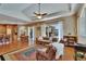 Inviting living room with hardwood floors, sofa, and a view of the screened-in patio at 15724 Ibisridge Dr, Lithia, FL 33547