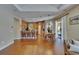 Open living space features hardwood floors, a kitchen, and a cozy dining area at 15724 Ibisridge Dr, Lithia, FL 33547
