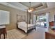 Comfortable main bedroom offers carpet, ensuite, and pool access at 15724 Ibisridge Dr, Lithia, FL 33547