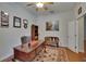 Elegant office with hardwood floors, decorative rug, and a substantial desk at 15724 Ibisridge Dr, Lithia, FL 33547