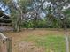 Serene backyard enclosed by fencing, providing a safe and picturesque environment with mature trees at 1641 Thompson Rd, Lithia, FL 33547
