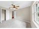 Bedroom with neutral walls, carpet floors, window, and closet at 1641 Thompson Rd, Lithia, FL 33547