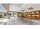 Unique carport design with wooden accents and hanging plants providing natural light at 1641 Thompson Rd, Lithia, FL 33547