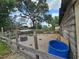Practical chicken coop with ample outdoor space, perfect for raising chickens and enjoying fresh eggs at 1641 Thompson Rd, Lithia, FL 33547