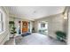 Covered entrance with a decorative door and lots of natural light at 1641 Thompson Rd, Lithia, FL 33547