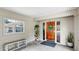 Covered porch with decorative door and bench at 1641 Thompson Rd, Lithia, FL 33547