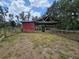 Spacious horse barn featuring ample shelter and open areas, ideal for equestrian enthusiasts and livestock at 1641 Thompson Rd, Lithia, FL 33547
