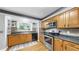 Galley kitchen with updated appliances and breakfast bar at 1641 Thompson Rd, Lithia, FL 33547