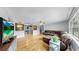 Open-concept living room with hardwood floors and a sectional sofa at 1641 Thompson Rd, Lithia, FL 33547