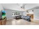 Large living room with tile floors, fan, and wet bar at 1641 Thompson Rd, Lithia, FL 33547