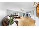 Open-concept living room with hardwood floors and a sectional sofa at 1641 Thompson Rd, Lithia, FL 33547