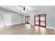 Open concept living area with two sets of french doors at 1641 Thompson Rd, Lithia, FL 33547