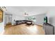 Open-concept living room with hardwood floors and a large window at 1641 Thompson Rd, Lithia, FL 33547