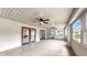 Spacious sun room with tile flooring, bright natural light, and dual ceiling fans at 1641 Thompson Rd, Lithia, FL 33547