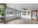 Enclosed sunroom with natural light and ample space for relaxing or entertaining at 1641 Thompson Rd, Lithia, FL 33547