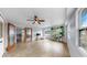 Bright and sunny sun room with views of the backyard, tiled floor and sliding glass door at 1641 Thompson Rd, Lithia, FL 33547