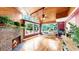 Sunroom with wood ceilings, brick fireplace, large windows and lots of natural light at 1641 Thompson Rd, Lithia, FL 33547