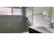 Beautiful bathroom with white marble tile and glass-enclosed shower at 16505 Lake Heather Dr, Tampa, FL 33618