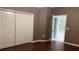 Bedroom with laminate flooring and an attached bathroom at 16505 Lake Heather Dr, Tampa, FL 33618