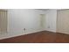 Comfortable bedroom with wood floors, neutral walls and two large windows at 16505 Lake Heather Dr, Tampa, FL 33618