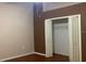 Bedroom featuring neutral walls, wood flooring, and closet with shelving at 16505 Lake Heather Dr, Tampa, FL 33618