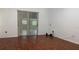 Bedroom featuring wood-look floors and sliding glass doors at 16505 Lake Heather Dr, Tampa, FL 33618