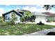 Beautifully landscaped home exterior with vibrant green lawn, enhancing curb appeal at 16505 Lake Heather Dr, Tampa, FL 33618