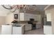 Kitchen featuring white cabinets, stainless steel appliances, and tile flooring at 16505 Lake Heather Dr, Tampa, FL 33618