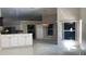 Open-concept kitchen and dining area with tile flooring and lots of natural light at 16505 Lake Heather Dr, Tampa, FL 33618