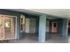 Spacious living area featuring tile floors and multiple sliding glass doors at 16505 Lake Heather Dr, Tampa, FL 33618