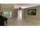Spacious living room with tile floors, neutral walls, and lots of natural light at 16505 Lake Heather Dr, Tampa, FL 33618