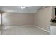 Neutral living room offers tile flooring, ceiling fan, and a bright, open space at 16505 Lake Heather Dr, Tampa, FL 33618