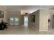 Open concept living room with tile floors, neutral paint, and bright open spaces at 16505 Lake Heather Dr, Tampa, FL 33618
