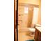 Traditional bathroom with a combination tub and shower, classic tiling, and wooden vanity at 16536 Caldwell Ln, Spring Hill, FL 34610