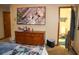 Bedroom featuring dresser, TV, and ensuite bathroom access at 16536 Caldwell Ln, Spring Hill, FL 34610