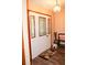 Elegant front door with decorative glass inserts and stylish sidelights, complemented by hardwood floors at 16536 Caldwell Ln, Spring Hill, FL 34610