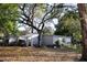 Charming single-Gathering home featuring mature landscaping, providing privacy and curb appeal to the residence at 16536 Caldwell Ln, Spring Hill, FL 34610
