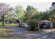 Property view with several outbuildings, providing ample storage and workspace options at 16536 Caldwell Ln, Spring Hill, FL 34610
