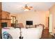 Spacious living area with fireplace offers comfort and style, featuring wood-look flooring at 16536 Caldwell Ln, Spring Hill, FL 34610
