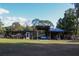 View of outbuildings with workshop and storage, ideal for hobbies and projects at 16536 Caldwell Ln, Spring Hill, FL 34610